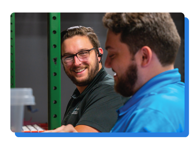 Employees smiling and interacting